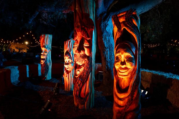The wood sprit family carved from trees by Chainsaw Jenna...