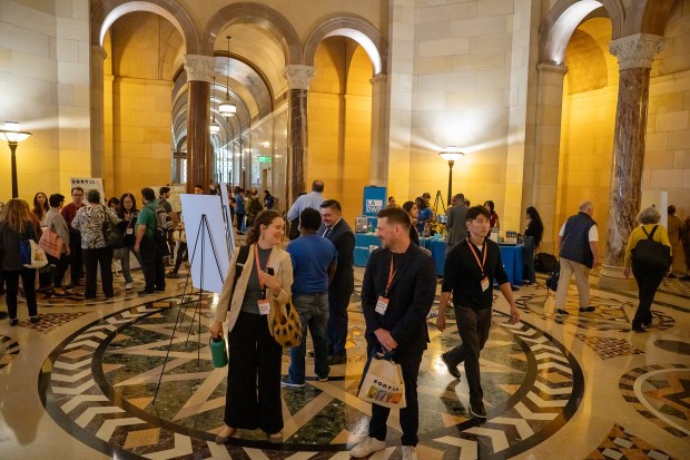 Attendees mingle with sponsors and community groups in the City...