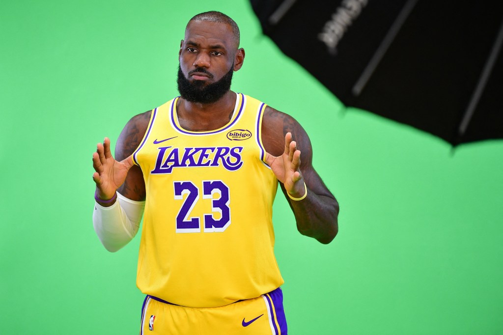 LeBron James wearing a yellow and purple Lakers jersey.