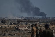 Smoke rises to the sky following an Israeli military strike in Gaza City, as seen from the...