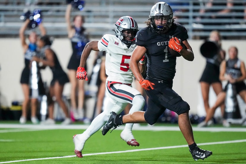 Denton Guyer running back  Kaedyn Cobbs (1) gets past Flower Mound Marcus defensive back...