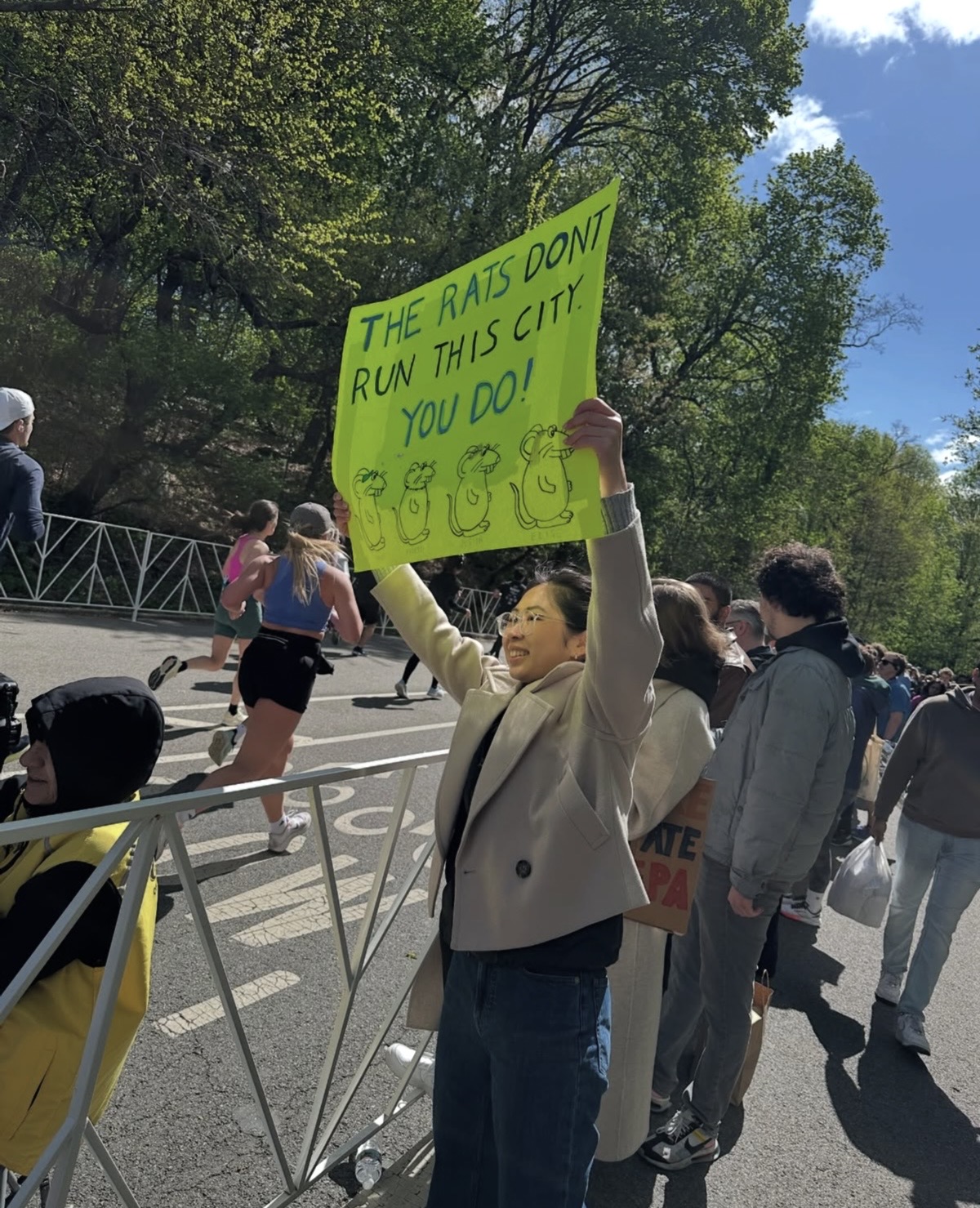 the sign reads: rats don't run this city, you do!