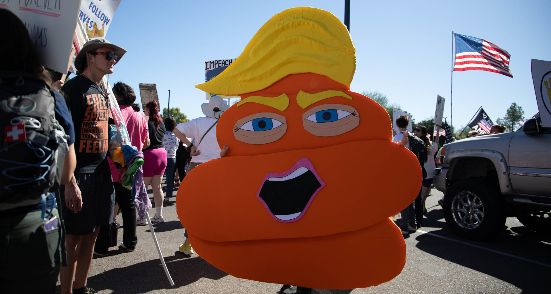 donald trump as an orange pile of poop with baby doll arms