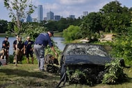 Mike Holmberg of MARK9 Search and Rescue and his German Sheppard Ashton search one of two...