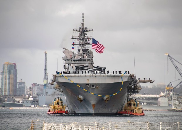 Amphibious assault ship USS Tripoli (LHA 7) transits San Diego Harbor as the ship returns to homeport, Nov. 29, 2022. (Mass communication Specialist 2nd Class Brett McMinoway / U.S. Navy)