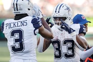 Dallas Cowboys running back Javonte Williams (33) celebrates his fourth quarter touchdown...