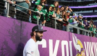 Philadelphia Eagles tight end Dallas Goedert smiles after talking with fans before the game.
