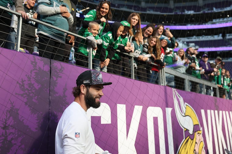 Philadelphia Eagles tight end Dallas Goedert smiles after talking with fans before the game.