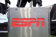 An ESPN logo is viewed on an equipment locker before an NFL football game between the...
