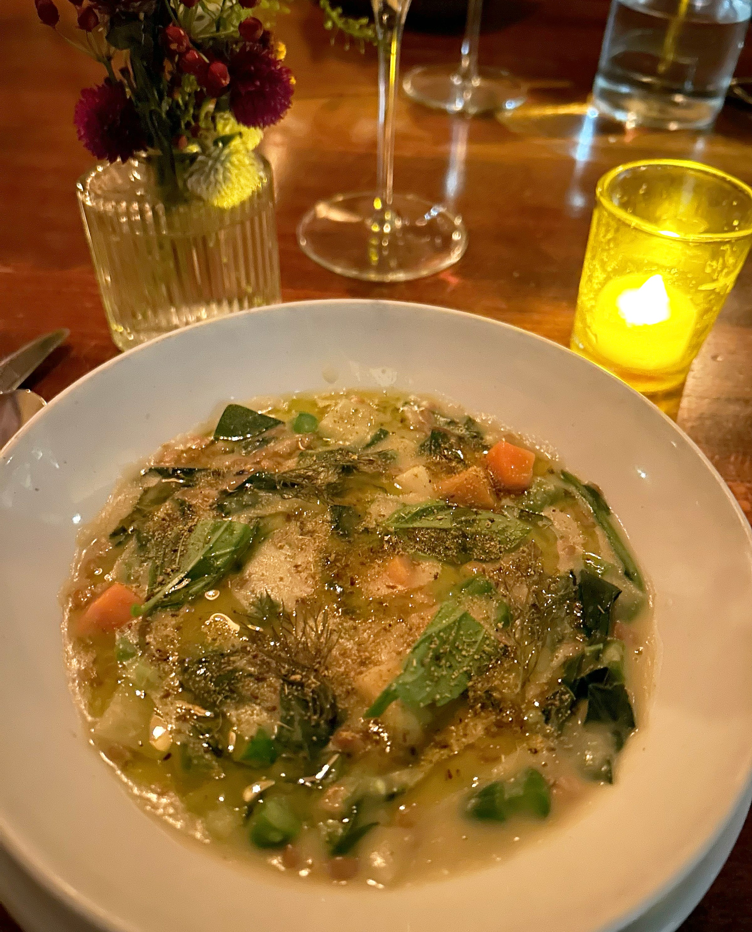 A plate of vegetable soup.