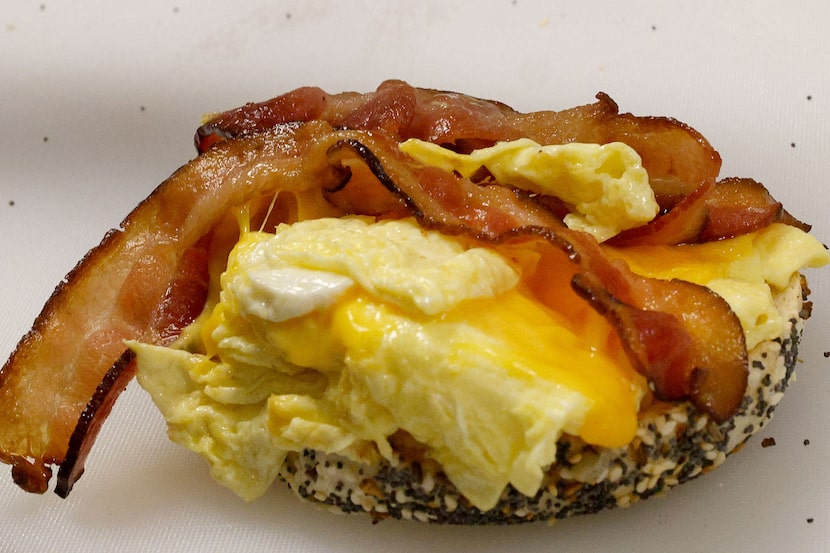 A breakfast bagel sandwich at Bagel Bros can come with bacon, egg and cheddar cheese.
