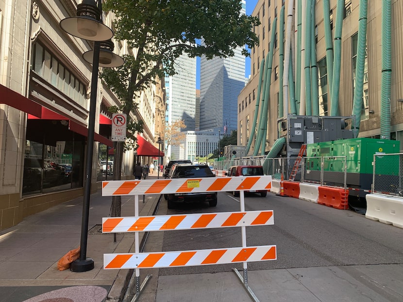 The downtown Neiman Marcus, at left, will be staying -- though with a smaller retail...