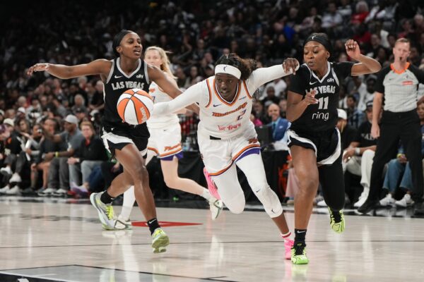 Phoenix Mercury guard Kahleah Copper (2) drives the ball past Las Vegas Aces guards Jackie Young (0) and Dana Evans (11) during the second quarter of game two of the 2025 WNBA Finals at Michelob Ultra Arena.