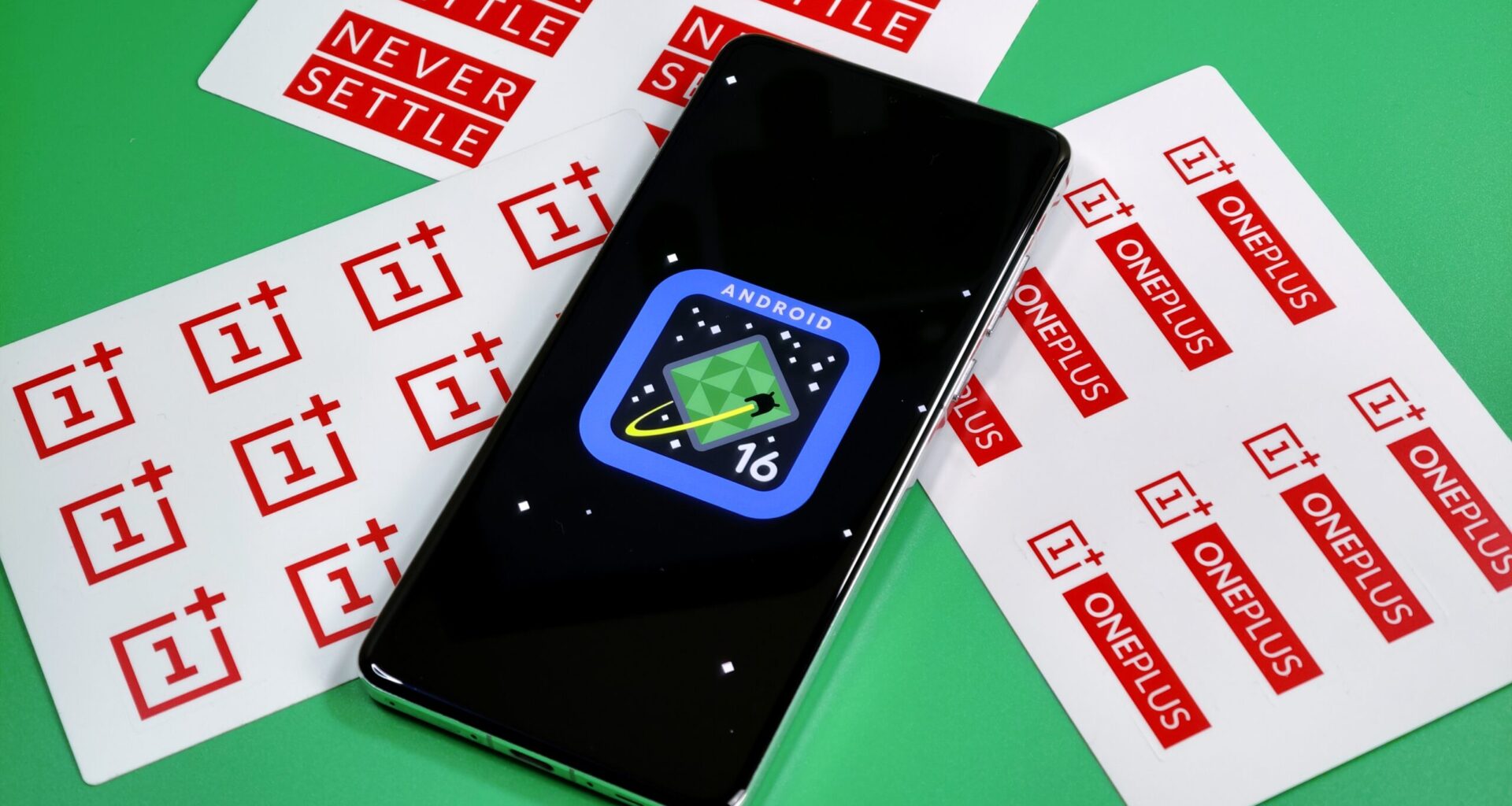 Photo of Android 16 logo on a OnePlus 13