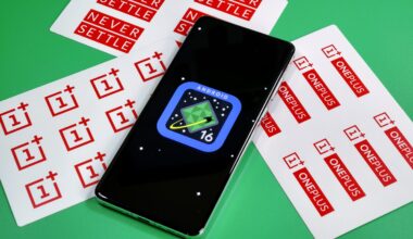 Photo of Android 16 logo on a OnePlus 13