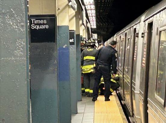 Police and firefighters respond after a man was killed by a Q train at the Times Square-42nd St. subway station on Oct. 10, 2025. (Kerry Burke / New York Daily News)