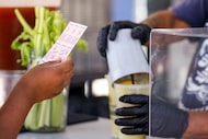 An attendee waits to exchange tickets for a drink at the State Fair of Texas on Oct. 6,...