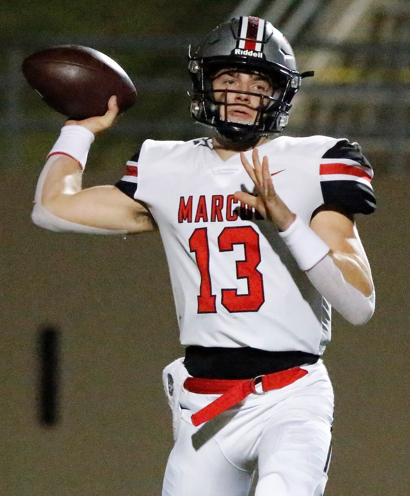Flower Mound Marcus High School quarterback Garrett Nussmeier (13) throws a pass during the...