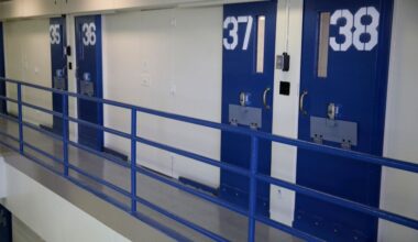 solitary confinement cells with blue doors in a prison