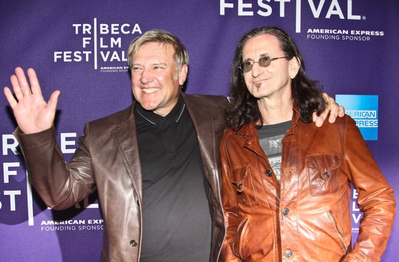 Alex Lifeson, left, and Geddy Lee of Rush attend the RUSH: Beyond the Lighted Stage premiere during the 2010 TriBeCa Film Festival.
