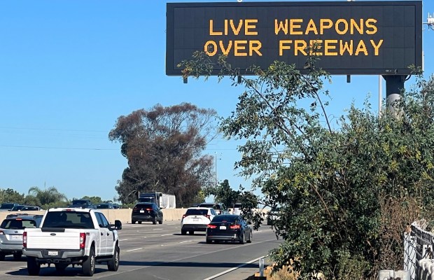 CalTrans signs over Interstate 5 warn motorists about the closure of the freeway on Saturday over a planned live-fire demonstration at Camp Pendleton that will be witnessed by Vice President JD Vance and Defense Secretary Pete Hegseth. (Hayne Palmour IV / For The San Diego Union-Tribune)