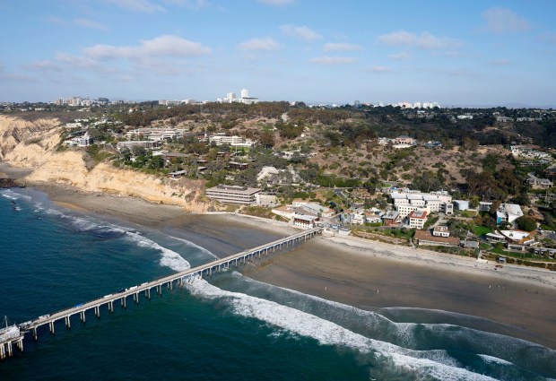 In an aerial photo, the Ellen Browning Scripps Memorial Pier and UC San Diego's Scripps Institution of Oceanography is seen along the La Jolla coast on Oct. 7, 2025 in San Diego, CA. (K.C. Alfred / The San Diego Union-Tribune)