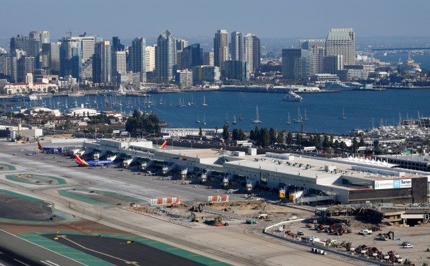 In an aerial photo, San Diego International Airport's new Terminal 1 is seen with San Diego Bay and downtown in the background on Oct. 7, 2025 in San Diego, CA. (K.C. Alfred / The San Diego Union-Tribune)