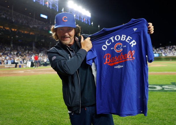 Eddie Vedder of the rock band Pearl Jam stands on the field after the Chicago Cubs beat the San Diego Padres in Game 3 of the NL Wild Card Series at Wrigley Field on Oct. 2, 2025 in Chicago, Illinois. (Photo by K.C. Alfred / The San Diego Union-Tribune)