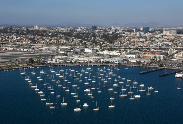 In an aerial photo, boats are moored at the Laurel Street Roadstead in San Diego Bay on Oct. 7, 2025 in San Diego, CA. (K.C. Alfred / The San Diego Union-Tribune)