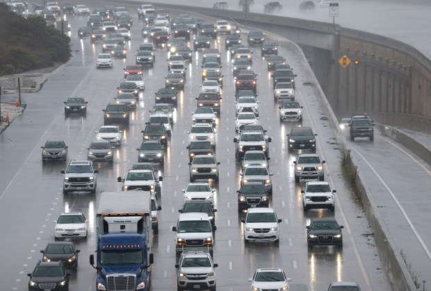 Traffic backs up on southbound Interstate 805 in Sorrento Valley during a steady rain Tuesday. (K.C. Alfred / The San Diego Union-Tribune)