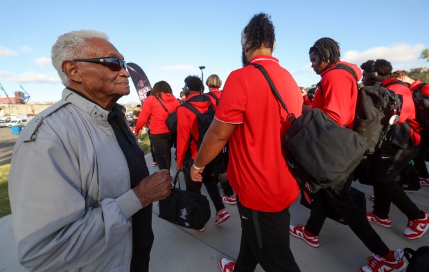 Bert Robinson Sr. looks for great-grandson Bert Emanuel Jr. as Aztecs make their way to Snapdragon Stadium during the Warrior Walk on Friday, Oct. 03, 2025. (Hayne Palmour IV / For The San Diego Union-Tribune)