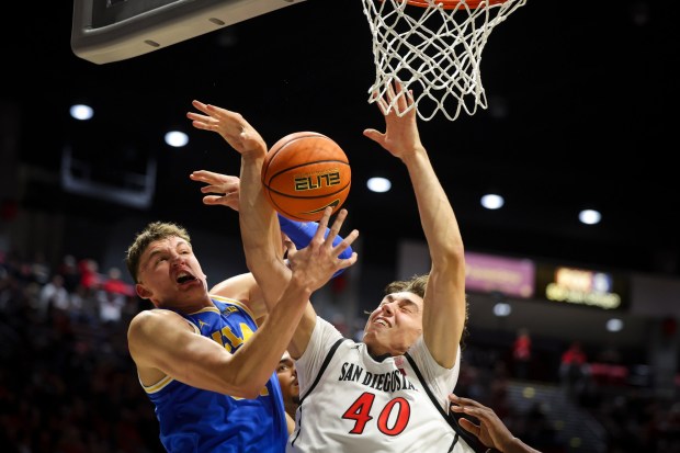 Tyler Bilodeau #34 of UCLA and Miles Heide #40 of San Diego State vie for the rebound during an exhibition game at Viejas Arena on Friday, Oct. 17, 2025 in San Diego, California. (Meg McLaughlin / The San Diego Union-Tribune)