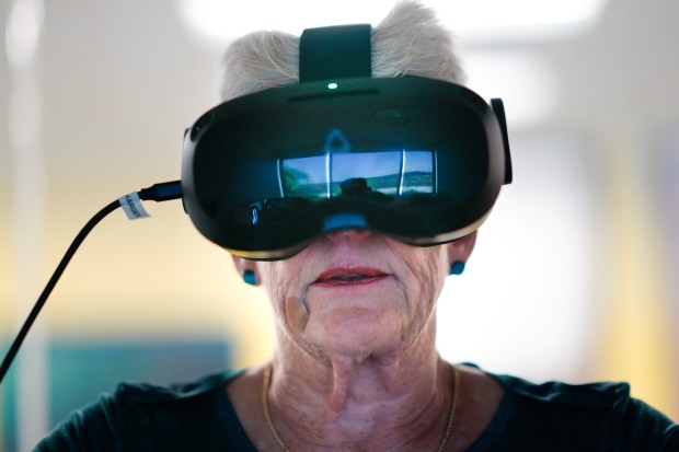 Roxanne Hoffert, 66, is participates in the Brain Research Health Study at UCSD on Tuesday, Oct. 21, 2025, in San Diego, CA.  Hoffert takes a VR tour riding a stationary bicycle 3 times a week for the next 16 weeks, lasting close to 30 minutes on each tour. (Nelvin C. Cepeda / The San Diego Union-Tribune)