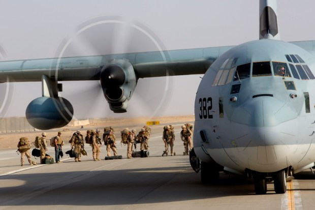 At Bastion Airfield in Helmand Province, Afghanistan, some of the last Marines left on Camp Leatherneck board a C-130 for the official withdrawal of U.S. Marines on Oct. 27, 2014. (Nelvin C. Cepeda / The San Diego Union-Tribune)