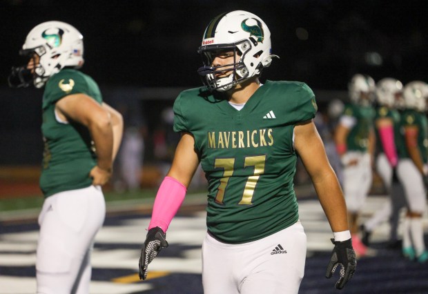 La Costa Canyon's Justin Lee and teammates begin their warmup before La Costa Canyon's football game against San Marcos at La Costa Canyon High School in Carlsbad on Friday, Oct. 10, 2025. (Hayne Palmour IV / For The San Diego Union-Tribune)
