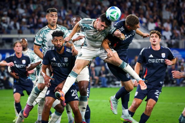David Ayala #24 of the Portland Timbers and Christopher McVey #97 of San Diego FC head the ball during match one of the Western Conference Round One of the 2025 MLS Cup Playoffs at Snapdragon Stadium on Sunday, Oct. 26, 2025 in San Diego, California. (Meg McLaughlin / The San Diego Union-Tribune)