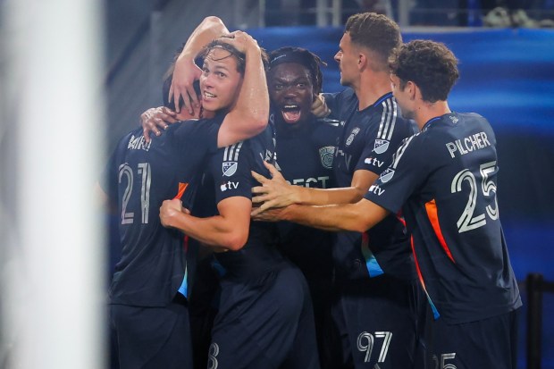 San Diego FC players celebrate after a goal against the Portland Timbers during match one of the Western Conference Round One of the 2025 MLS Cup Playoffs at Snapdragon Stadium on Sunday, Oct. 26, 2025 in San Diego, California. (Meg McLaughlin / The San Diego Union-Tribune)