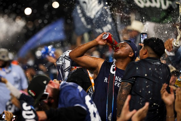 Supporters celebrate after San Diego FC defeated the Portland Timbers during match one of the Western Conference Round One of the 2025 MLS Cup Playoffs at Snapdragon Stadium on Sunday, Oct. 26, 2025 in San Diego, California. (Meg McLaughlin / The San Diego Union-Tribune)