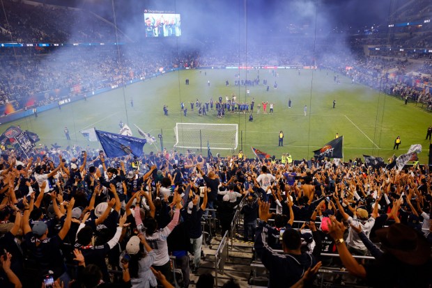 Fans celebrate after San Diego FC beat the Portland Timbers 2-1 in match one of the Western Conference Round One of the 2025 MLS Cup Playoffs at Snapdragon Stadium on Oct. 26, 2025 in San Diego, California. (Photo by K.C. Alfred / The San Diego Union-Tribune)