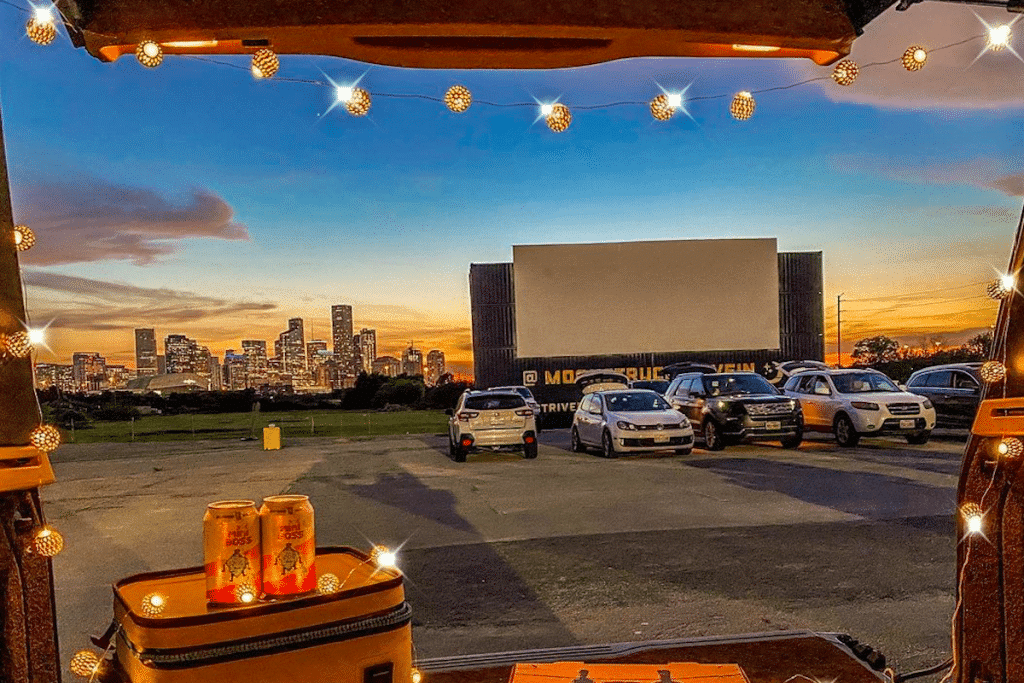 Image shows an outdoor cinema in Houston from the backseat of someone's car.