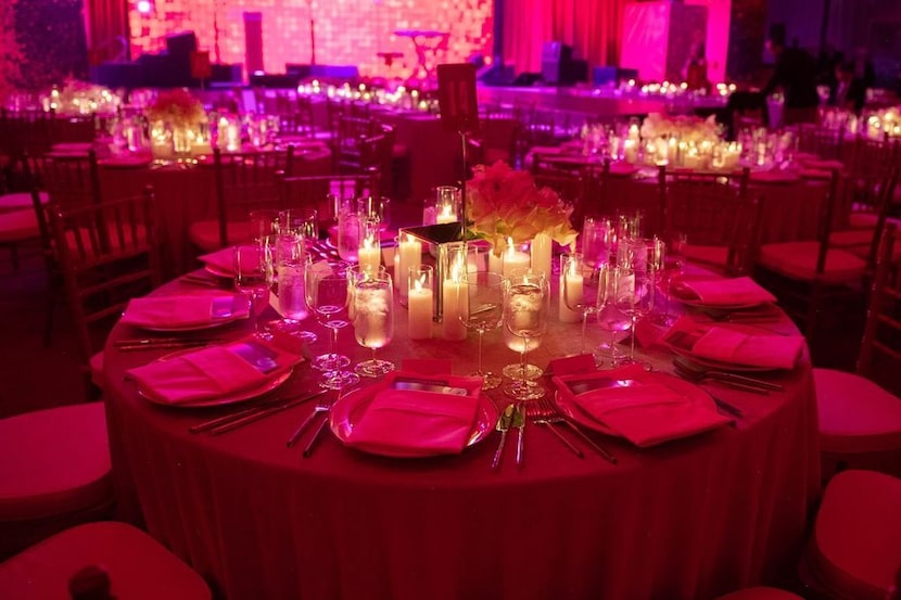A crowd of approximately 400 people at dinner at an outdoor tent decked out by Todd Fiscus'...