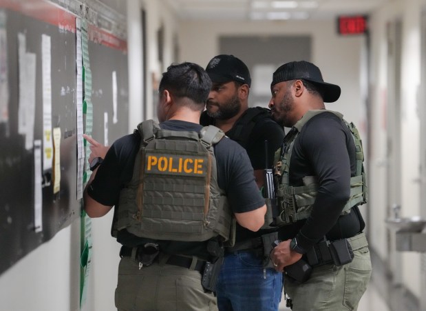 Federal law enforcement officers are pictured in the hallway outside immigration court at 26 Federal Plaza Tuesday, June 10, 2025 in the Manhattan, New York. (Barry Williams/ New York Daily News)
