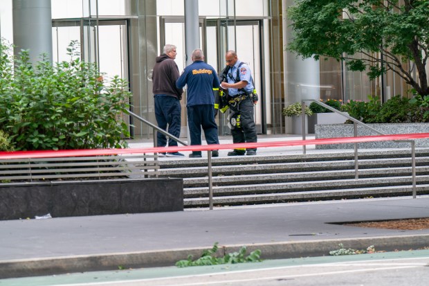 A glass pane, reportedly from the 30th floor, fell to the ground beneath the high-rise at 1345 6th Avenue in Manhattan on Sunday Oct. 12, 2025. 0831. It is not known if anyone was injured. (Theodore Parisienne / New York Daily News)