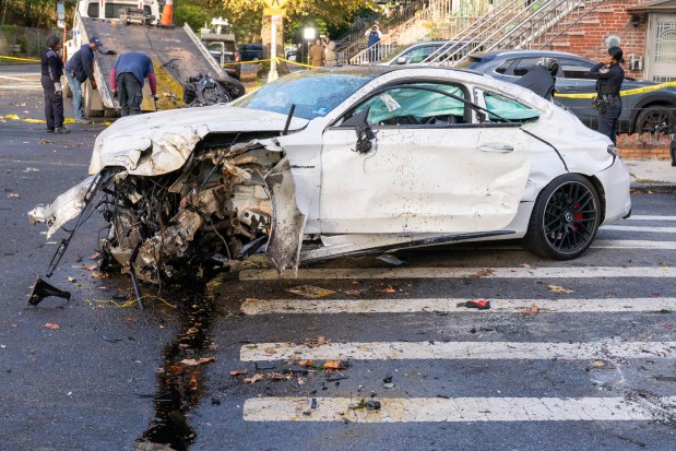 Cops said the Mercedes driver, who was in the center lane of the Belt Parkway, tried to exit the highway, crashing into the motorcyclist, forcing him into a chain-link fence. (Theodore Parisienne / New York Daily News)
