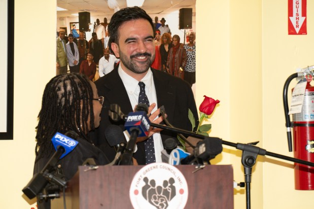 New York City Mayoral front-runner candidate Zohran Mamdani holds a rally at 966 Fulton Street, where he received a red Rose and participated in some painting with attendees in Brooklyn on Thursday Oct. 30, 2025. 1205. (Theodore Parisienne / New York Daily News)