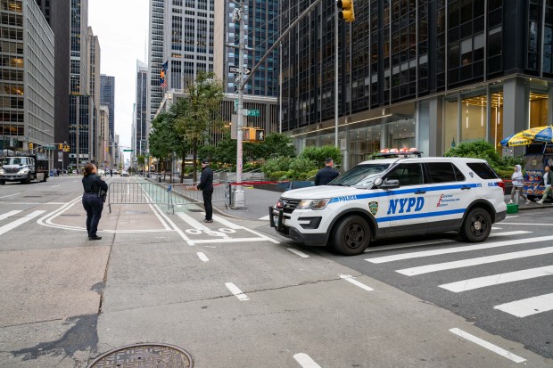 A glass window pane crashed to the ground beneath the high-rise at 1345 Sixth Ave. in Manhattan on Sunday, Oct. 12, 2025. (Theodore Parisienne / New York Daily News)
