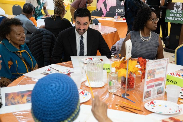 New York City Mayoral front-runner candidate Zohran Mamdani holds a rally at 966 Fulton Street, where he received a red Rose and participated in some painting with attendees in Brooklyn on Thursday Oct. 30, 2025. 1205. (Theodore Parisienne / New York Daily News)