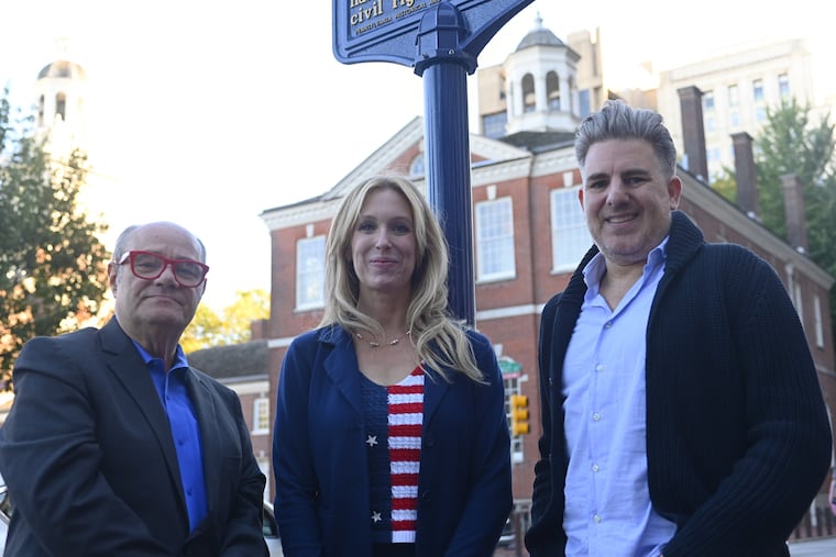 Mark Segal, founder and publisher of Philadelphia Gay News, Maita Soukup, VP Experience and Engagement of the Philadelphia Visitors Center and Neil Frauenglass, chief marketing officer of Visit Philadelphia, at the LGBTQ Historic Marker near Independence Mall, on October 9, 2025.