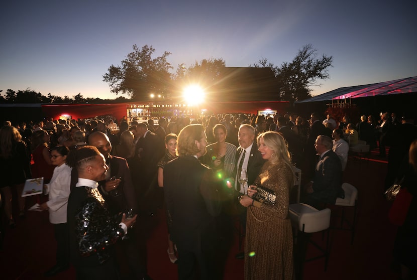 Guests mingle during the amfAR Foundation for AIDS research gala at the home of Kathleen and...