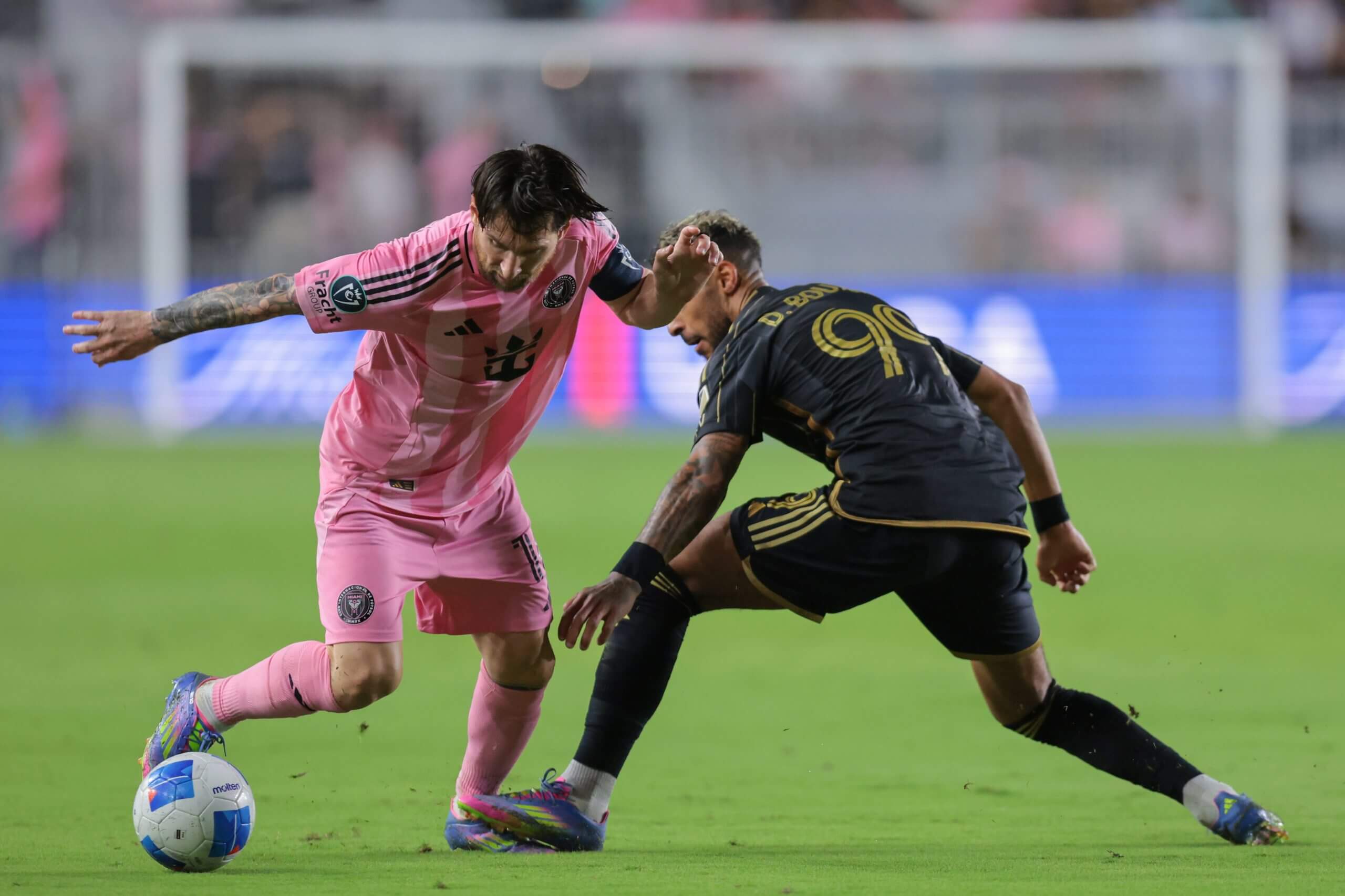 Lionel Messi and Denis Bouanga